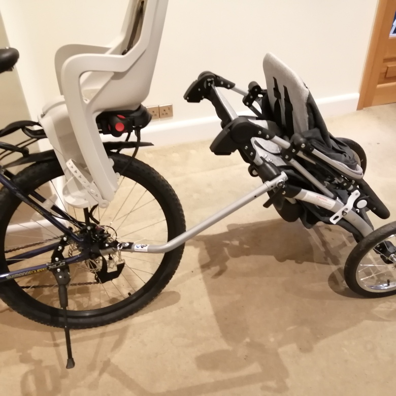 Push chair attached to bicycle