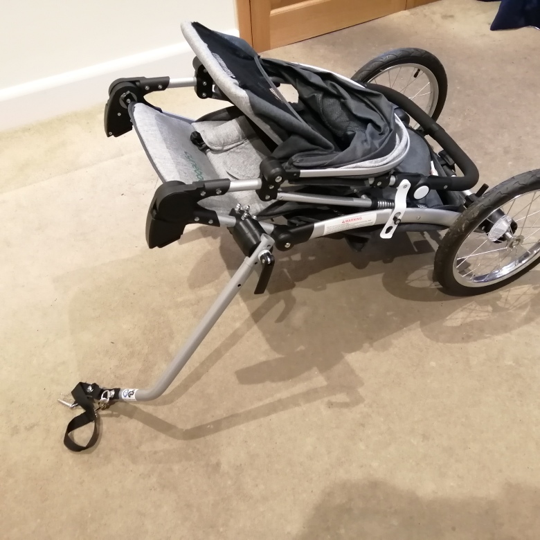 Close push chair and rest on tow arm