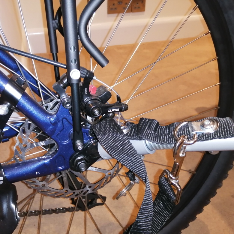 Remove safety clip and remove tow arm from bike